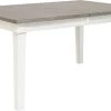 Benchcraft® Nollicott Whitewash/Light Gray Dining Extension Table -Furniture Store 438a326d 0dc0 4088 8e54 77ba1b59d4c0
