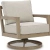 Signature Design By Ashley® Hallow Creek Driftwood Outdoor Swivel Lounge With Cushion