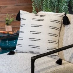 Signature Design By Ashley® Mudderly 4-Piece Black/White Pillow Set -Furniture Store fc4c840d fad5 4899 b59c f30a7062150a